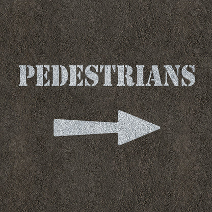 Pedestrians and arrow stencil painted on road