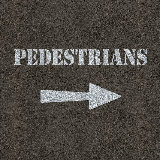 Pedestrians and arrow stencil painted on road