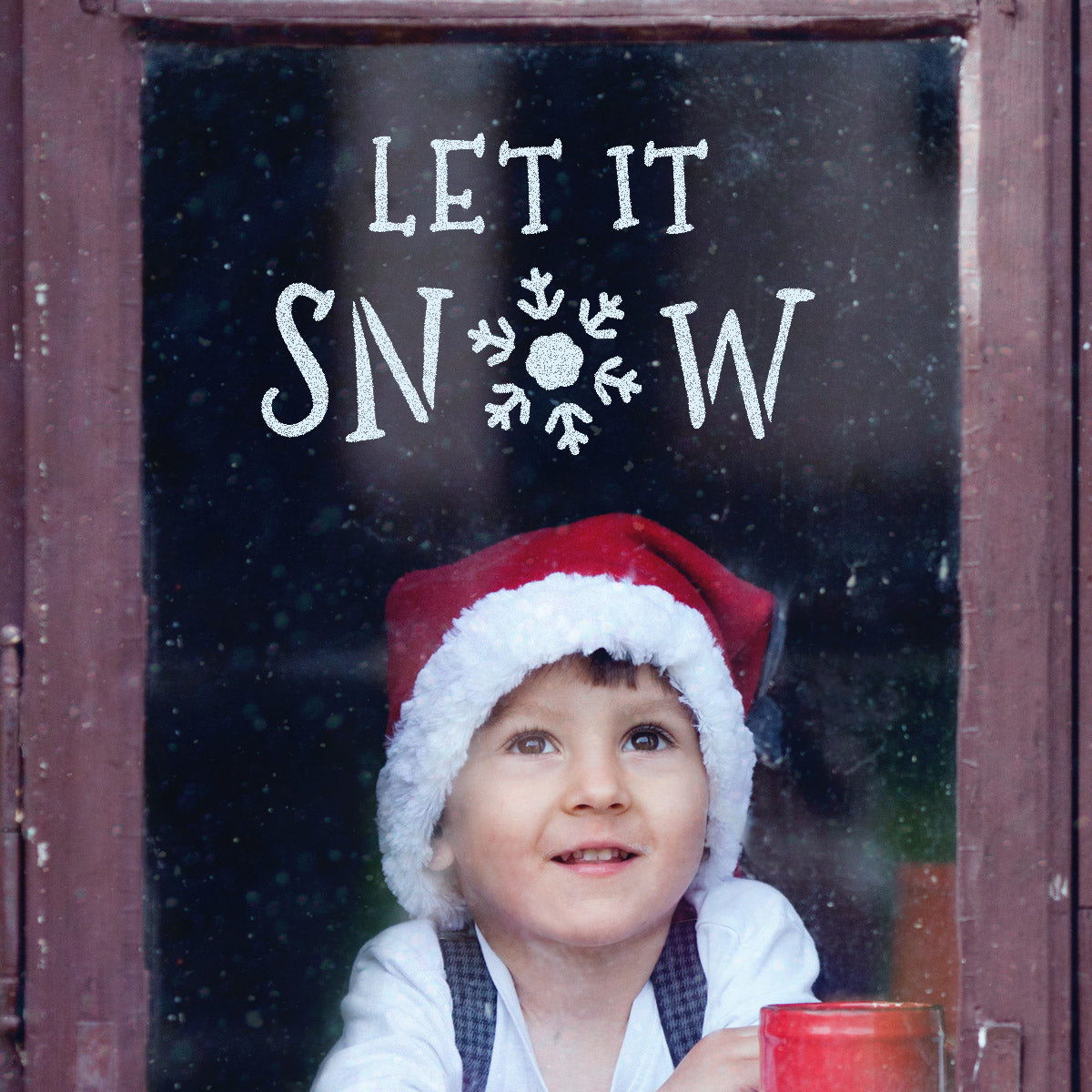 CraftStar Let It Snow Christmas Text Stencil on a Window