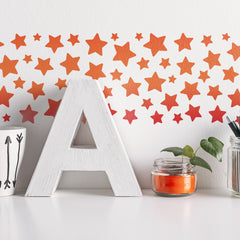 CraftStar Star Border Stencil painted in reds and oranges